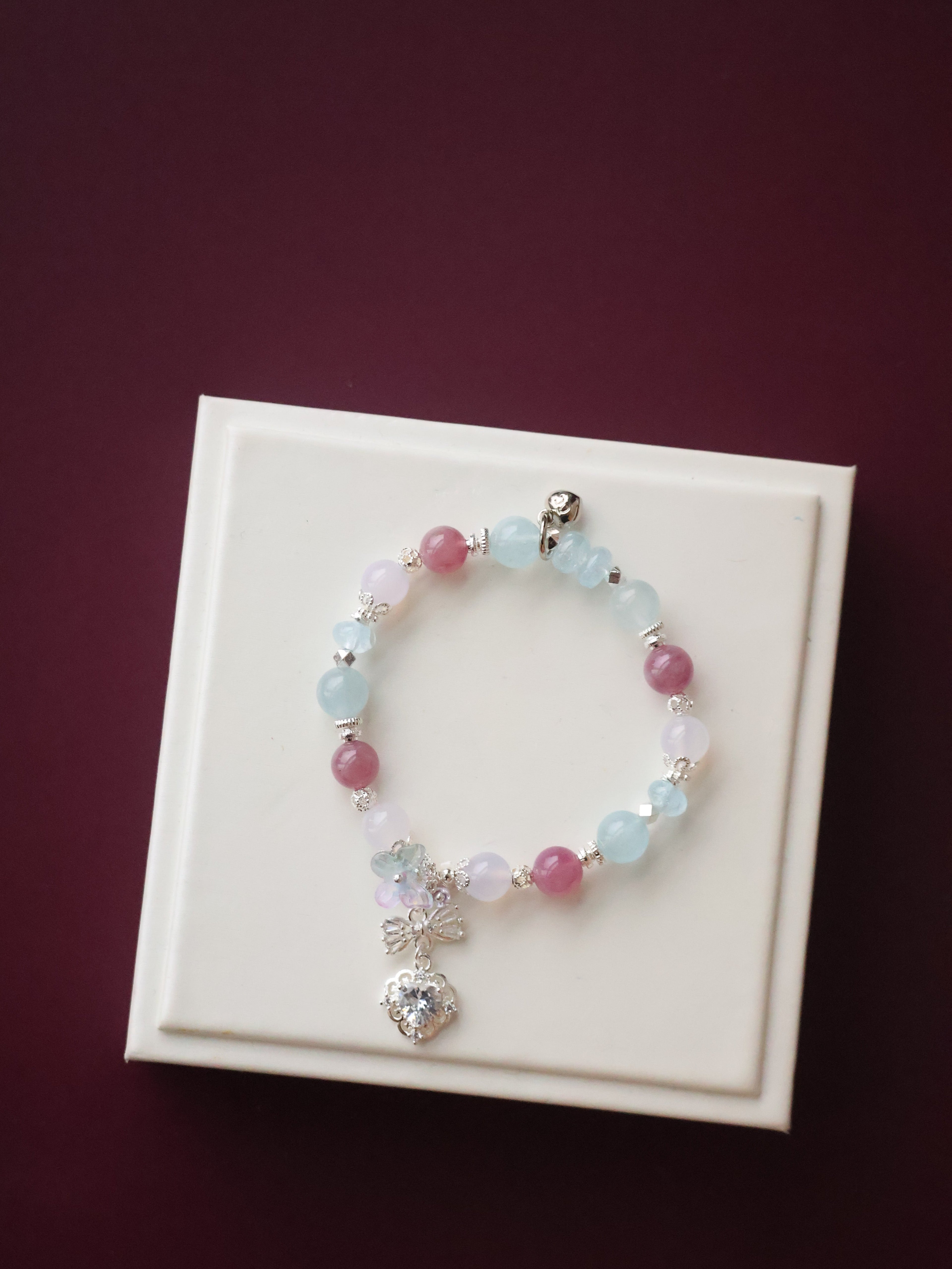 *Luna&Lithoss*  -  Blossara - 8mm Blue Topaz, Aquamarine, Lilac Chalcedony & Lavender Rose Quartz with Dangly Sparkly Heart and Butterfly Rainbow Charm (Elastic)
